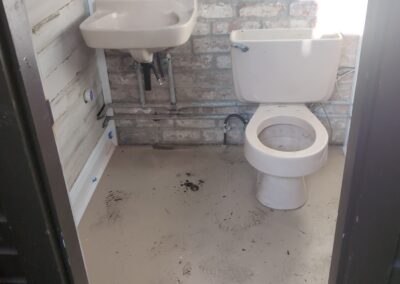 toilet installed in exterior bathroom